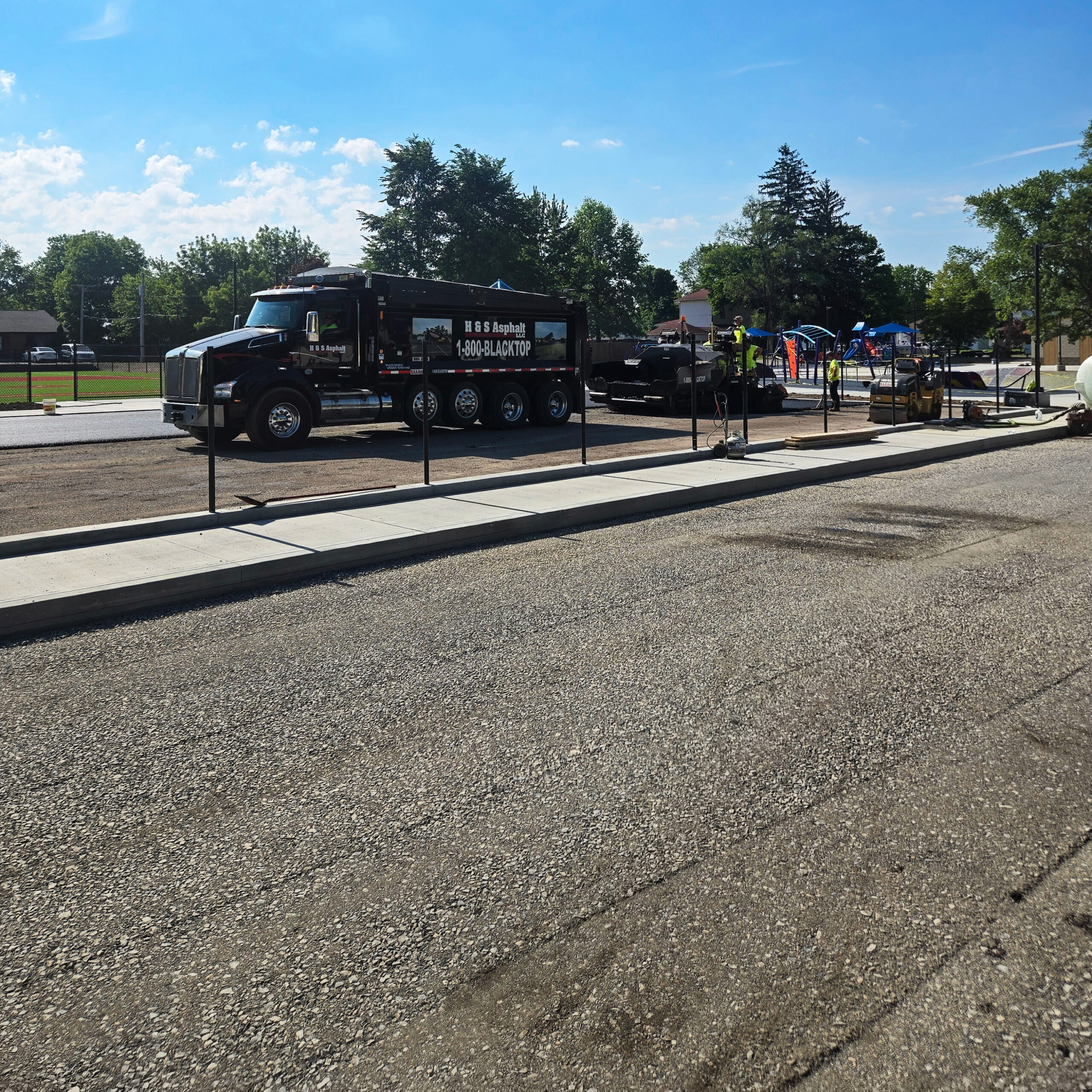 H&S Asphalt Truck Dumping Asphalt
