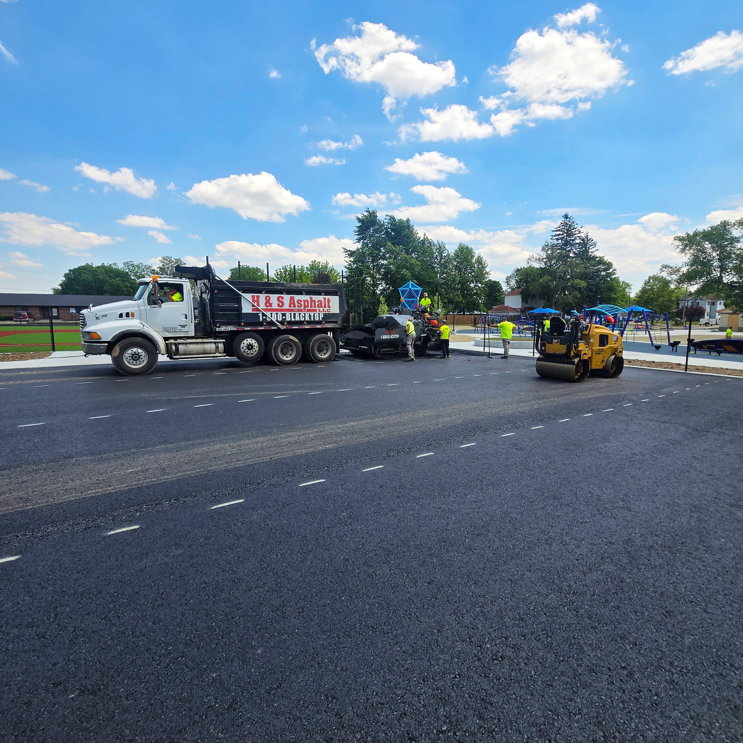 H&S Asphalt Truck Dumping Asphalt