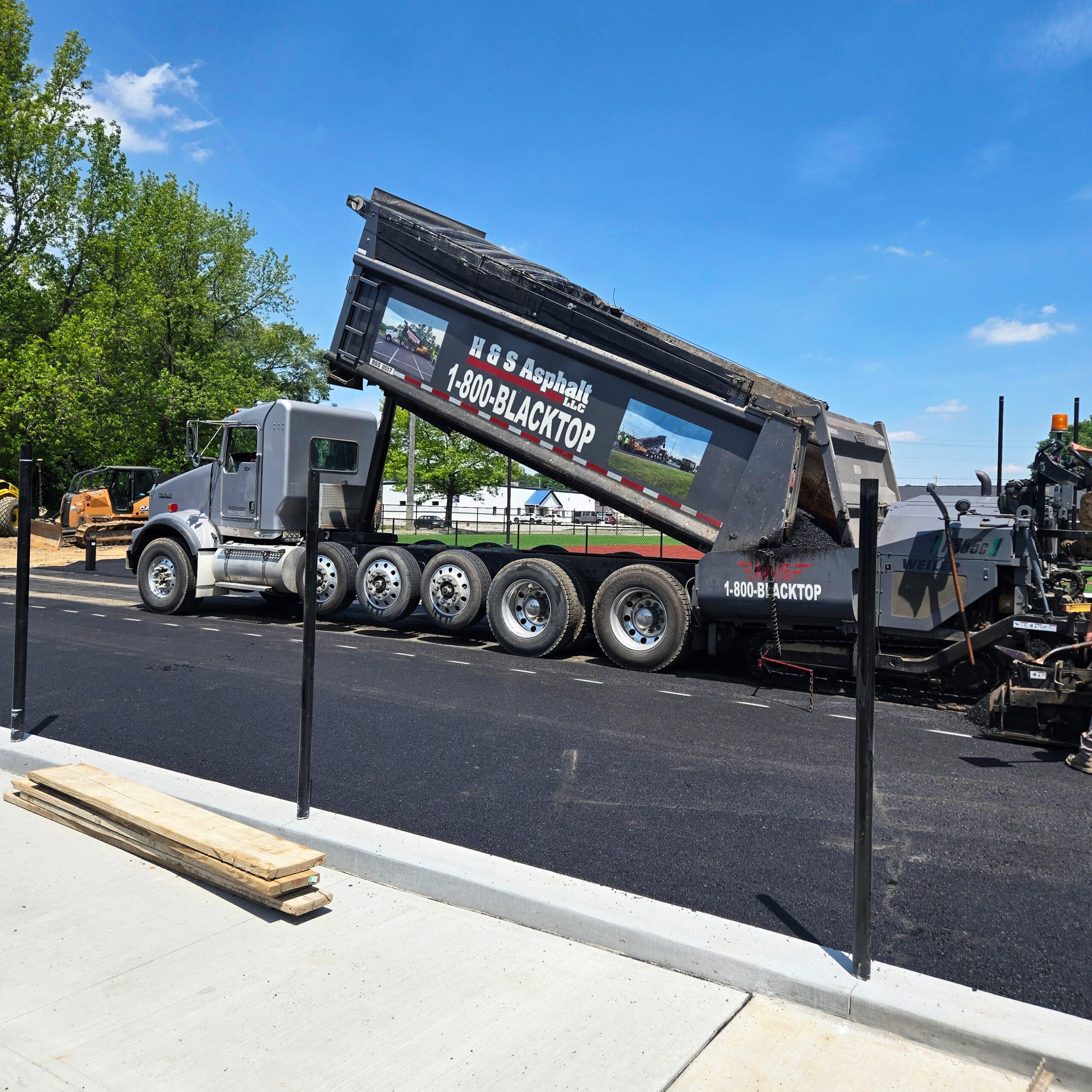 H&S Asphalt Truck Dumping Asphalt