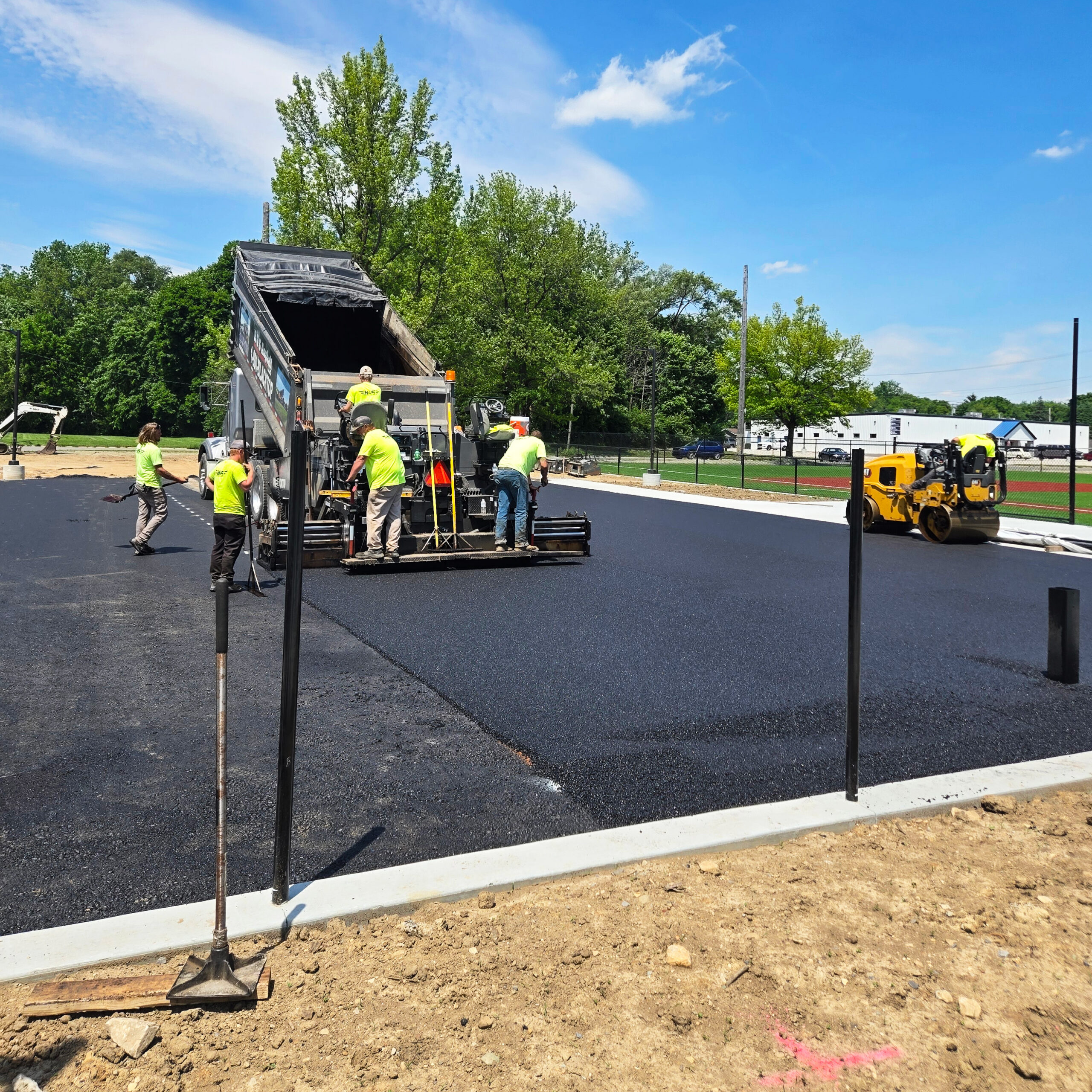 H&S Asphalt Crew Paving a Basketball Court