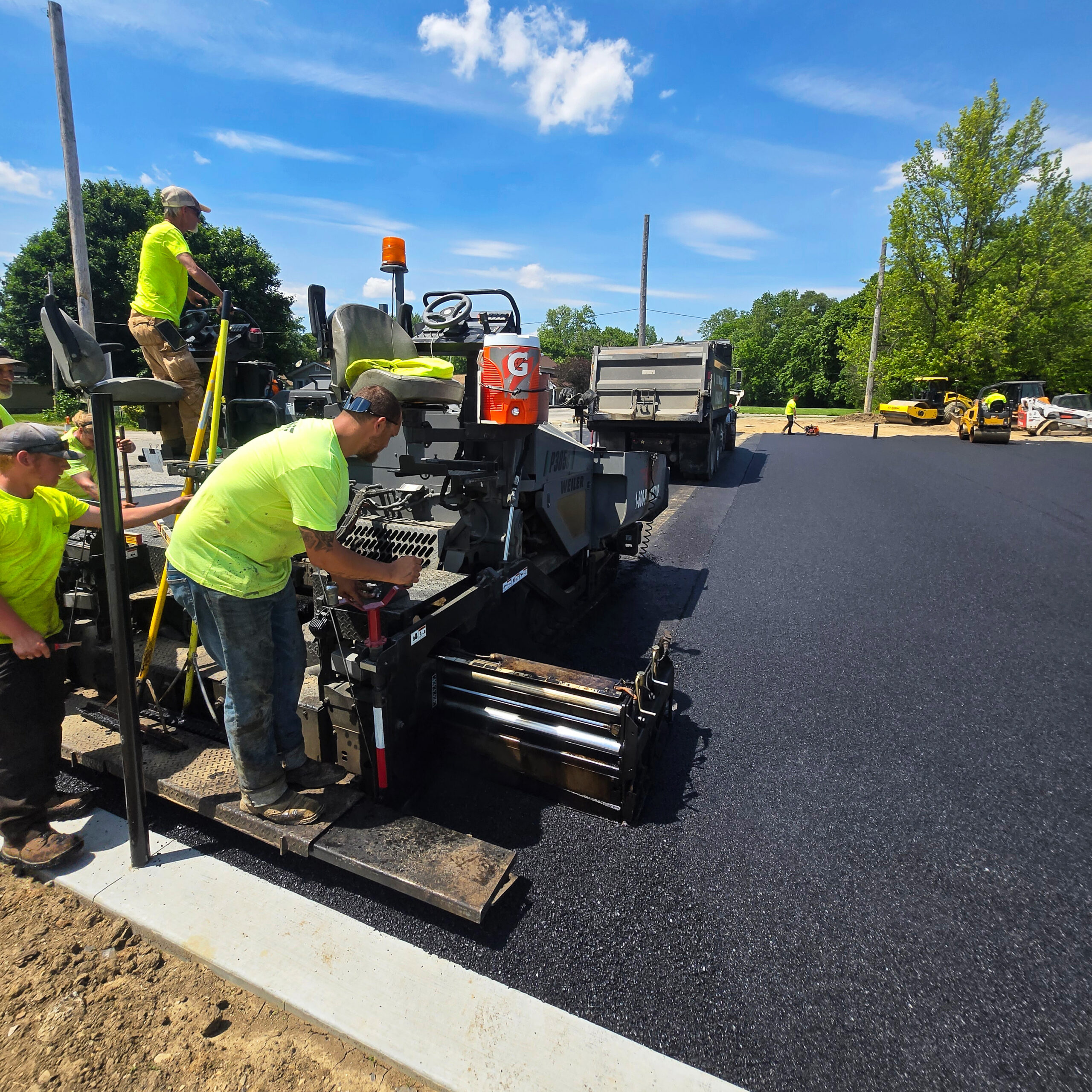 H&S Asphalt Crew Paving a Basketball Court