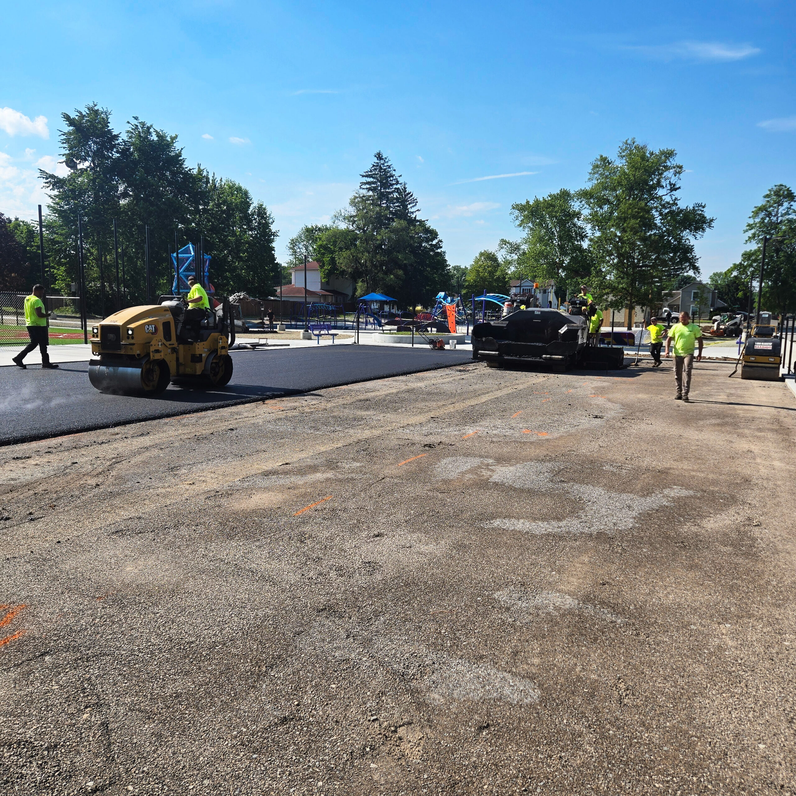 H&S Asphalt Crew Paving a Basketball Court
